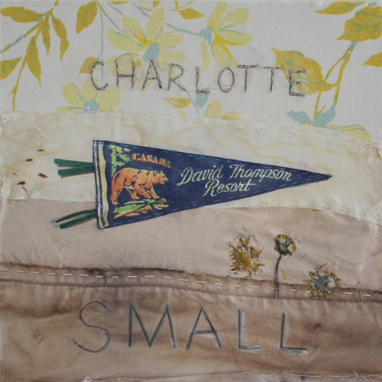 A painting on fabric with hand-written block letters reading "Charlotte Small". The painting has an image of a vintage pennant reading, "Canada: David Thompson Resort", depicting a bear emerging from a forest, and under the pennant are three pressed dandelions.